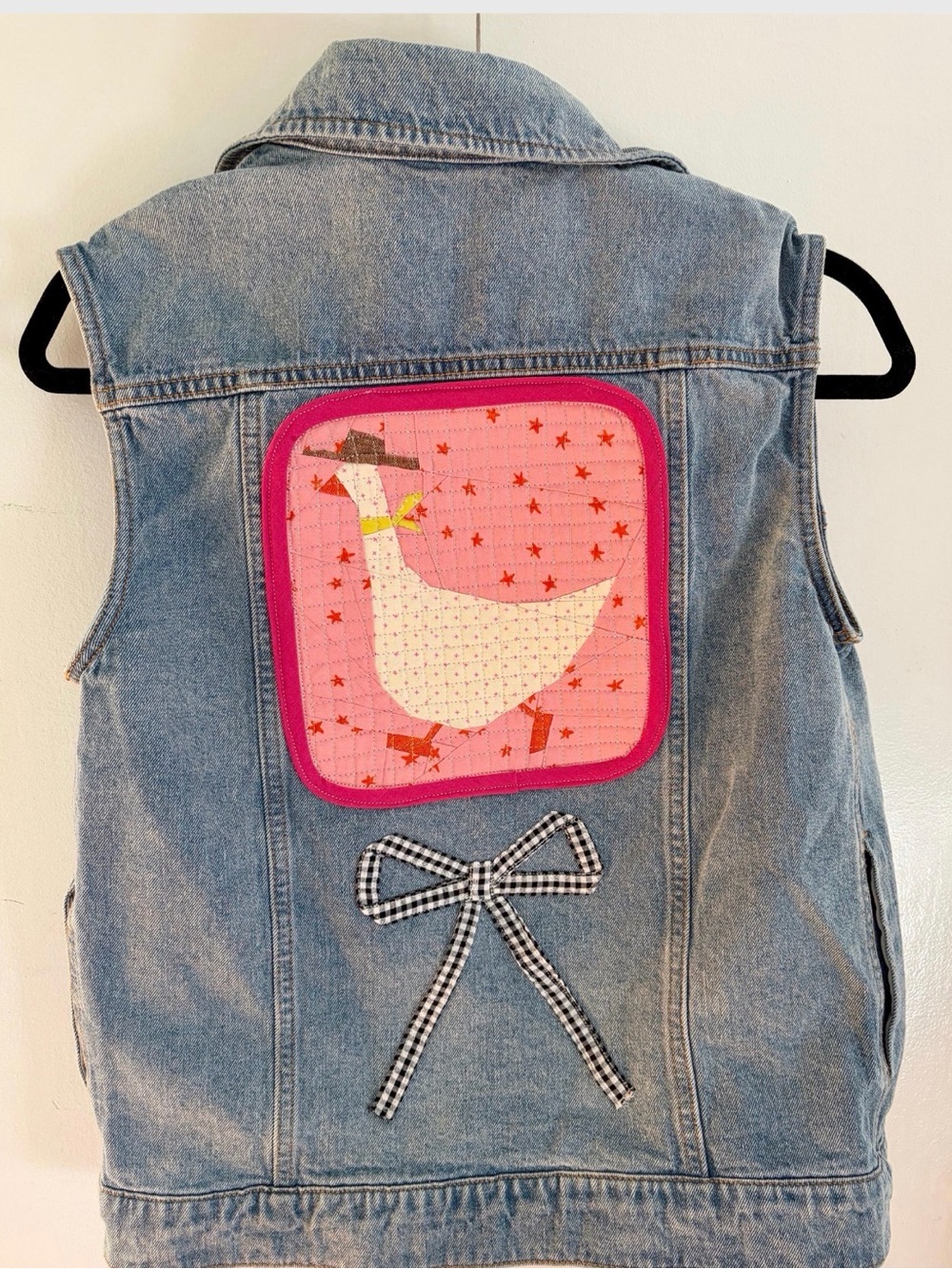 Upcycled Jean vest with a quilted cowboy goose and gingham bow on the back size